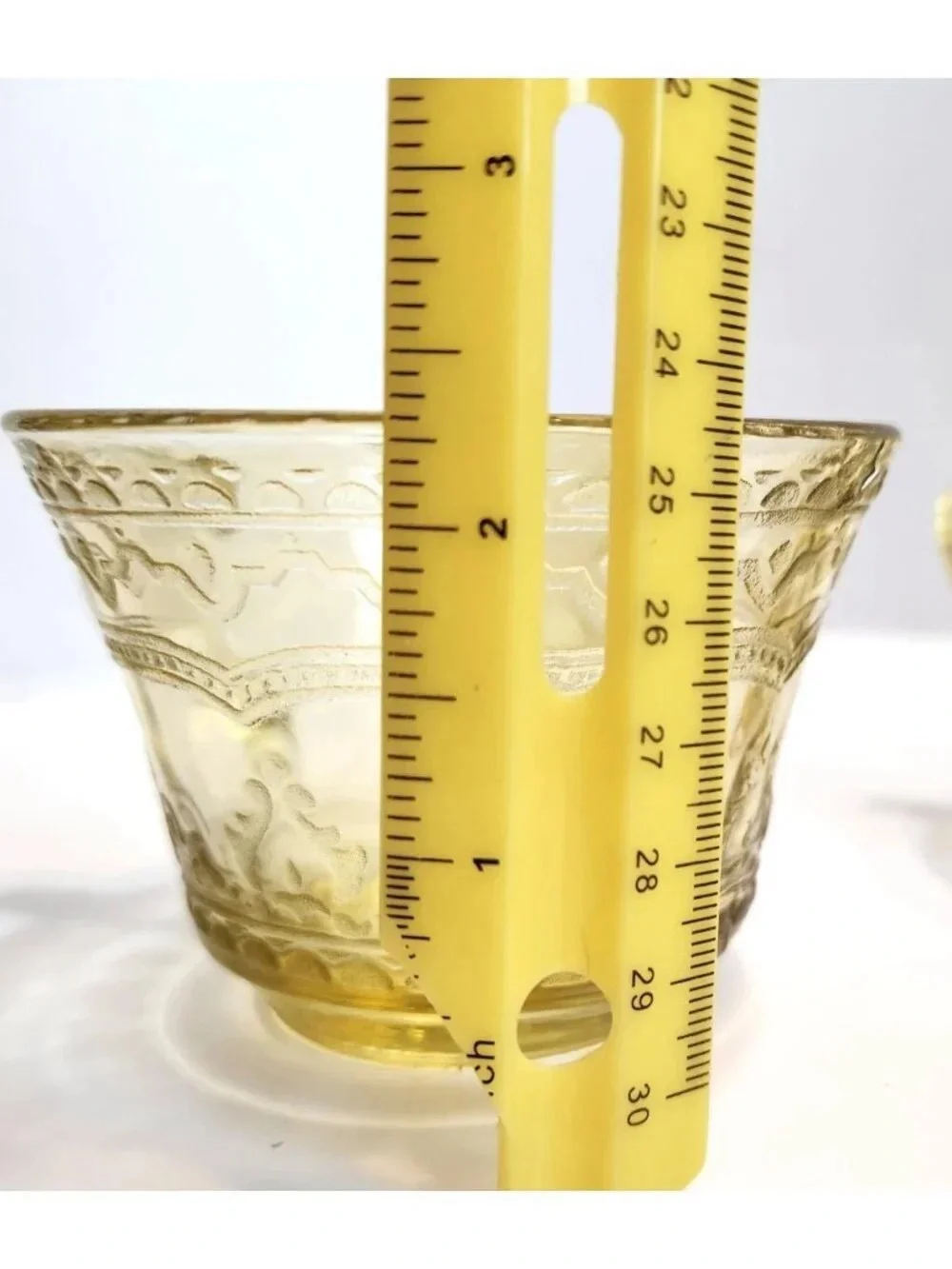 Elegant Amber Glass Teacup with Etched Decorative Pattern